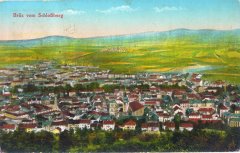 dobová pohlednice starého Mostu se zvonicí