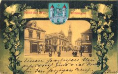 dobová pohlednice starého Mostu se zvonicí a děkanským kostelem