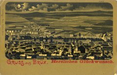 dobová pohlednice starého Mostu s děkanským kostelem a zvonicí