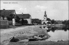 dobová pohlednice vsi s kostelem