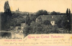 dobová pohlednice vsi s kostelem