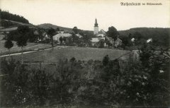 dobová pohlednice vsi s kostelem