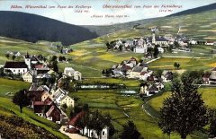 historické foto vsi s kostelem (vlevo)