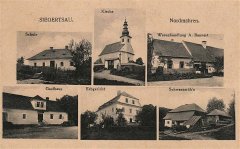 dobová pohlednice vsi s kostelem (nahoře uprostřed)