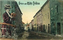 historická pohlednice části města s kostelem (v pozadí)