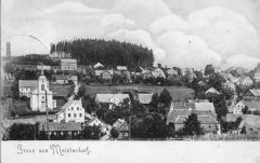 dobová pohlednice vsi s kostelem