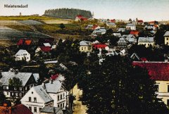 dobová pohlednice vsi s kostelem