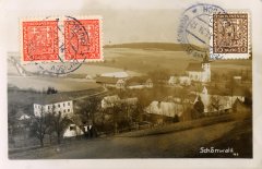 dobová pohlednice vsi s kostelem