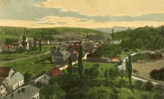 dobová pohlednice vsi s kostelem