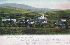 dobová pohlednice vsi s kostelem