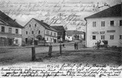 dobová pohlednice městyse s kostelem (věž v pozadí)