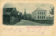 dobová pohlednice vsi s kostelem