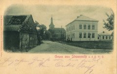 dobová pohlednice vsi s kostelem
