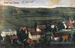 dobová pohlednice vsi s kostelem (vpravo)