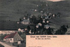 dobová pohlednice vsi s kostelem