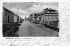 dobová pohlednice vsi s kostelem