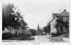 dobová pohlednice vsi s kostelem