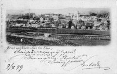 dobová pohlednice vsi s kostelem