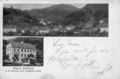 dobová pohlednice vsi s kostelem