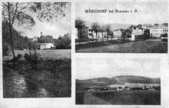 dobová pohlednice vsi s kostelem