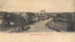 dobová pohlednice vsi s kostelem
