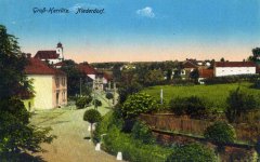 dobová pohlednice vsi s kostelem