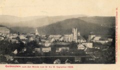 dobová pohlednice vsi s kostelem po požáru