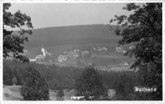 dobová pohlednice vsi s kostelem