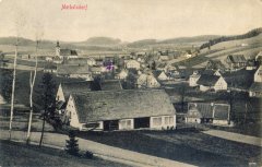 dobová pohlednice vsi s kostelem