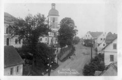 dobová pohlednice vsi s kostelem