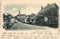 dobová pohlednice vsi s kostelem