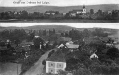 dobová pohlednice vsi s kostelem