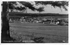 dobová pohlednice vsi s kostelem