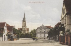 dobová pohlednice vsi s kostelem