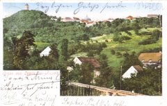 dobová pohlednice městyse s kostelem a zvonicí