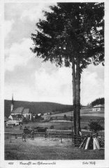 dobová pohlednice vsi s kostelem