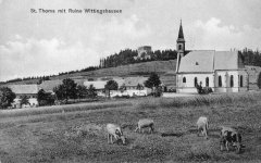 dobová pohlednice vsi s kostelem