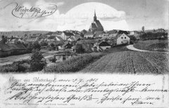 dobová pohlednice vsi s kostelem