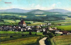 dobová pohlednice vsi s kostelem