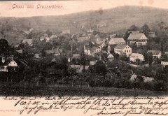 historická pohlednice obce s kaplí (vlevo, s věží)