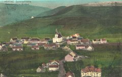 dobová pohlednice vsi s kostelem