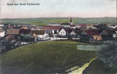 dobová pohlednice vsi s kostelem