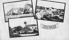 dobová pohlednice vsi s kostelem