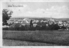 dobová pohlednice vsi s kostelem